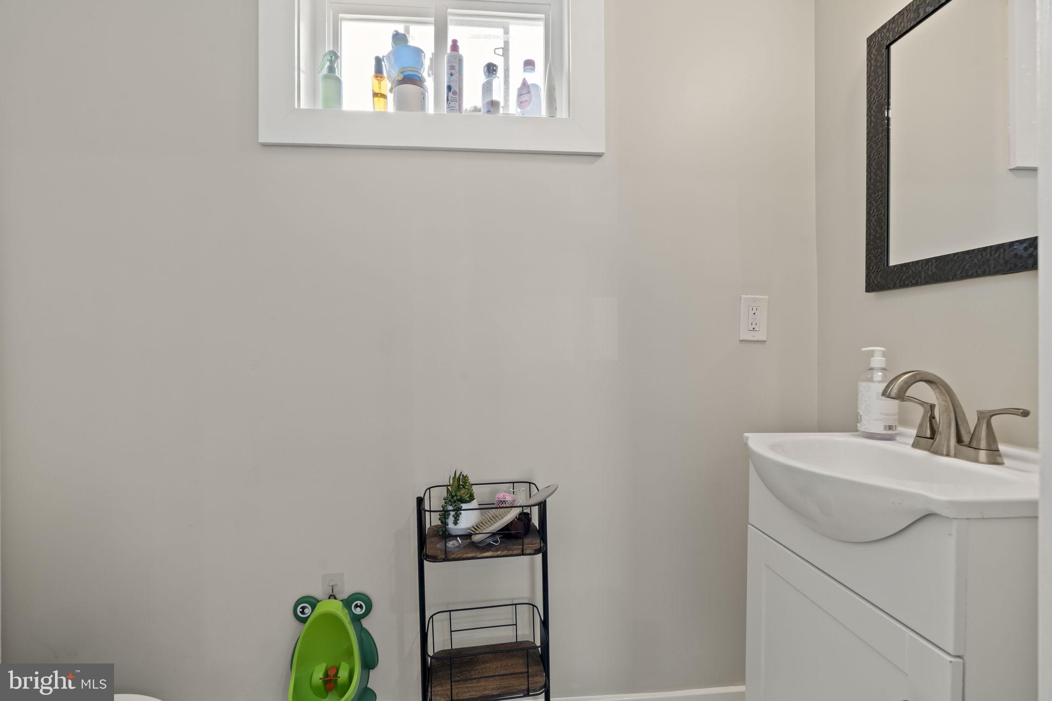 1901 Jackson Street Cinnaminson, NJ 08077 - Photo 12 of 40 a bathroom with a sink and a mirror