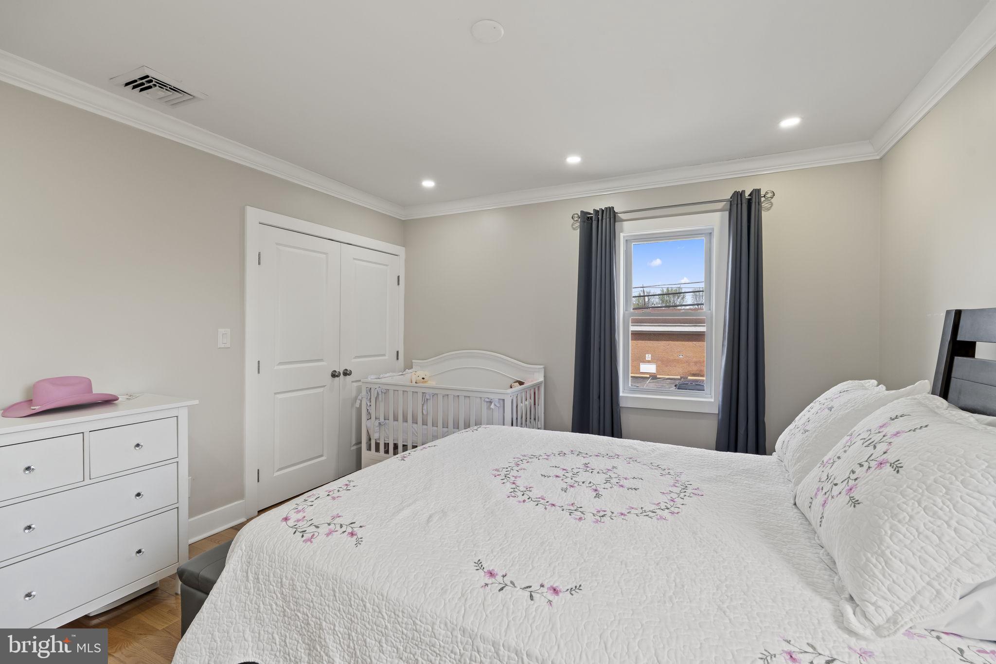 1901 Jackson Street Cinnaminson, NJ 08077 - Photo 14 of 40 a bedroom with a large bed and a dresser