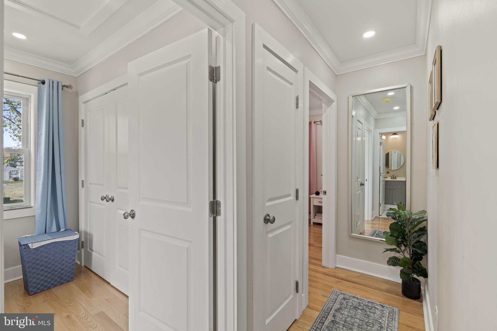 1901 Jackson Street Cinnaminson, NJ 08077 - Photo 18 of 40 a view of a hallway with wooden floor and a mirror