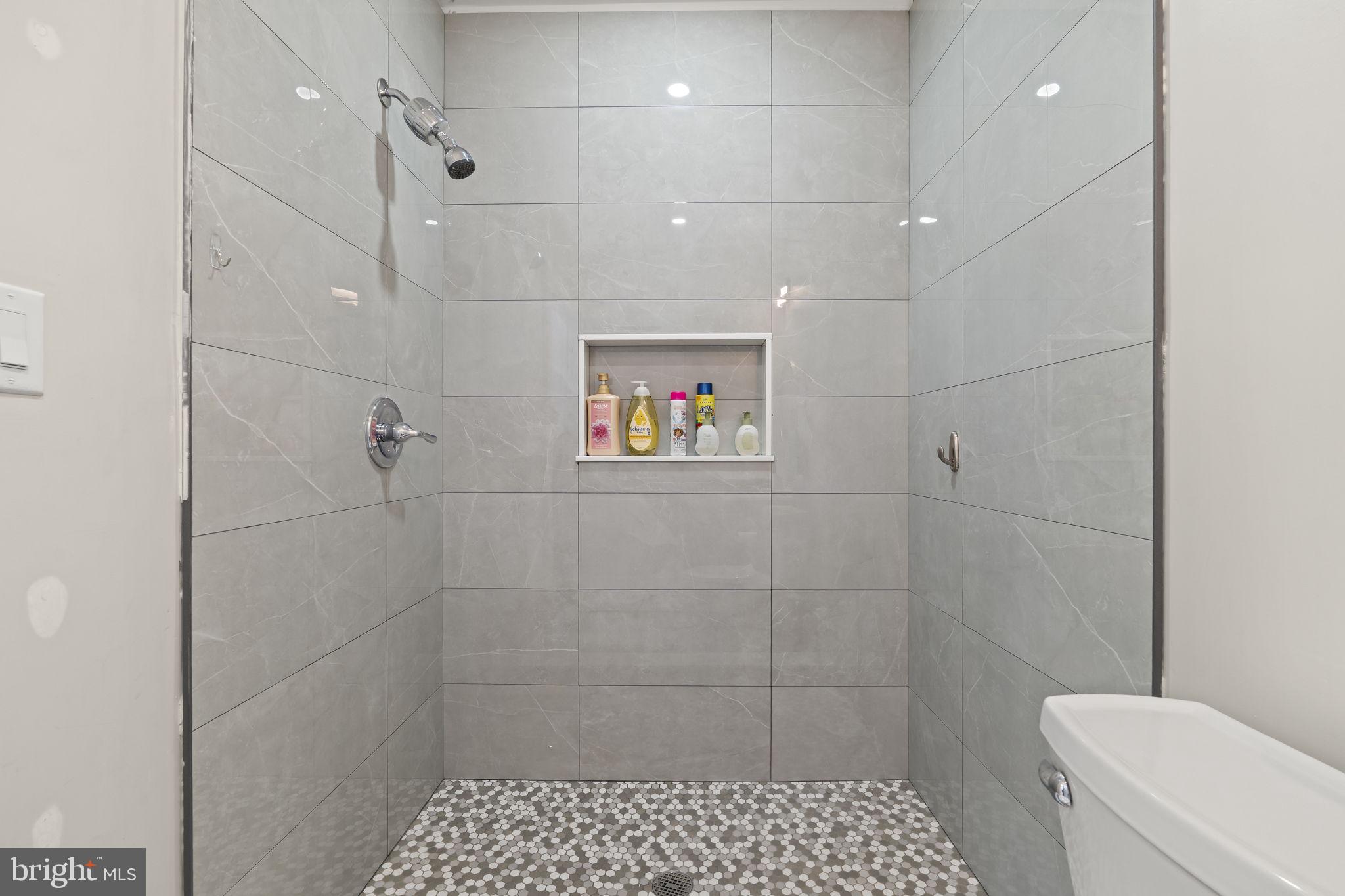 1901 Jackson Street Cinnaminson, NJ 08077 - Photo 20 of 40 a bathroom with a toilet sink and shower