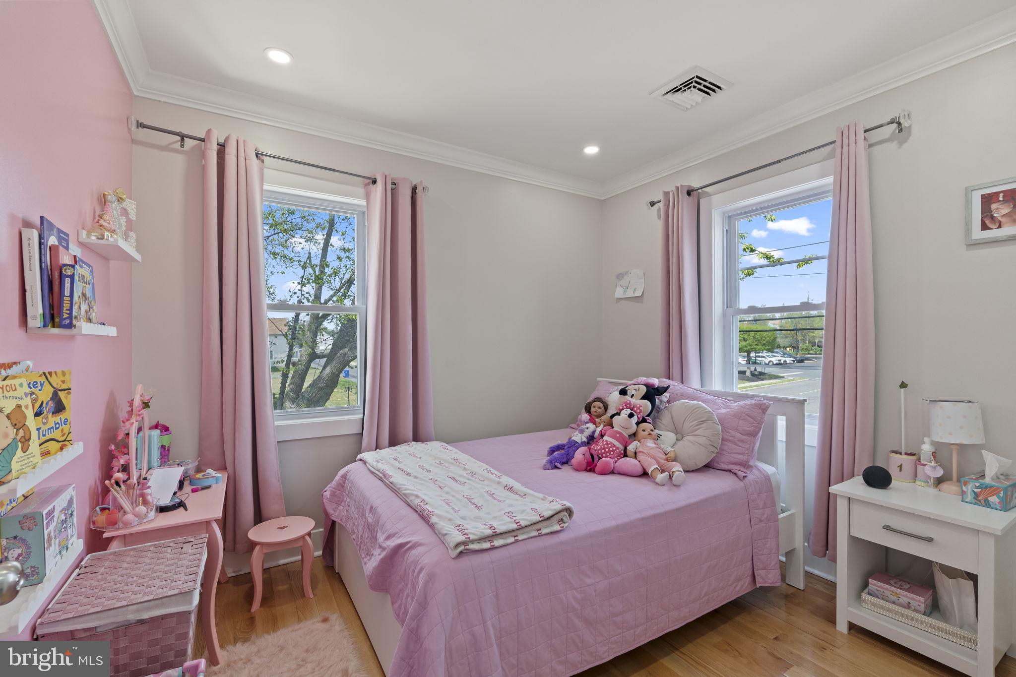 1901 Jackson Street Cinnaminson, NJ 08077 - Photo 23 of 40 a bedroom with a bed and a window