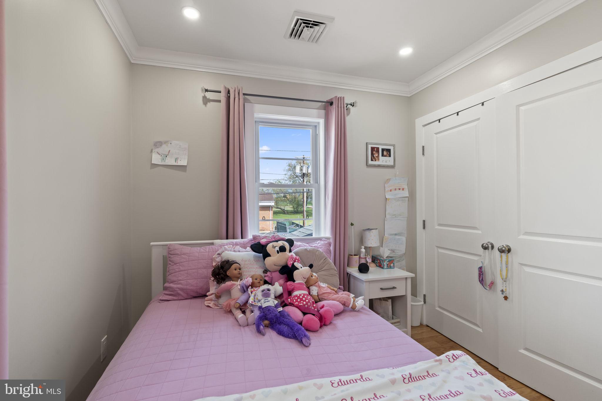 1901 Jackson Street Cinnaminson, NJ 08077 - Photo 24 of 40 a bed room with a bed and a window