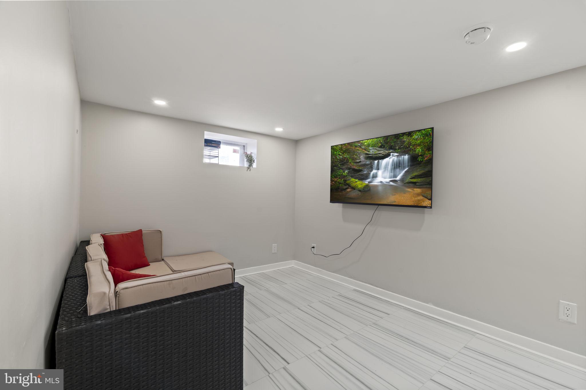 1901 Jackson Street Cinnaminson, NJ 08077 - Photo 28 of 40 a room with a bed and a couch