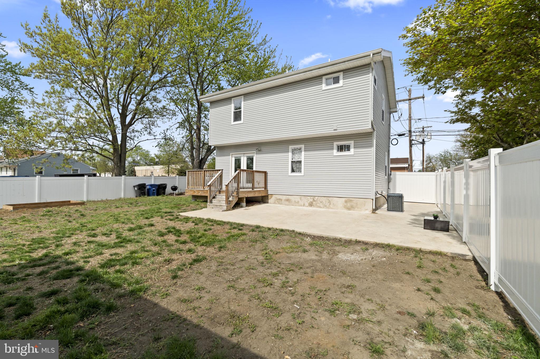 1901 Jackson Street Cinnaminson, NJ 08077 - Photo 35 of 40 a view of a yard with a house and a tree