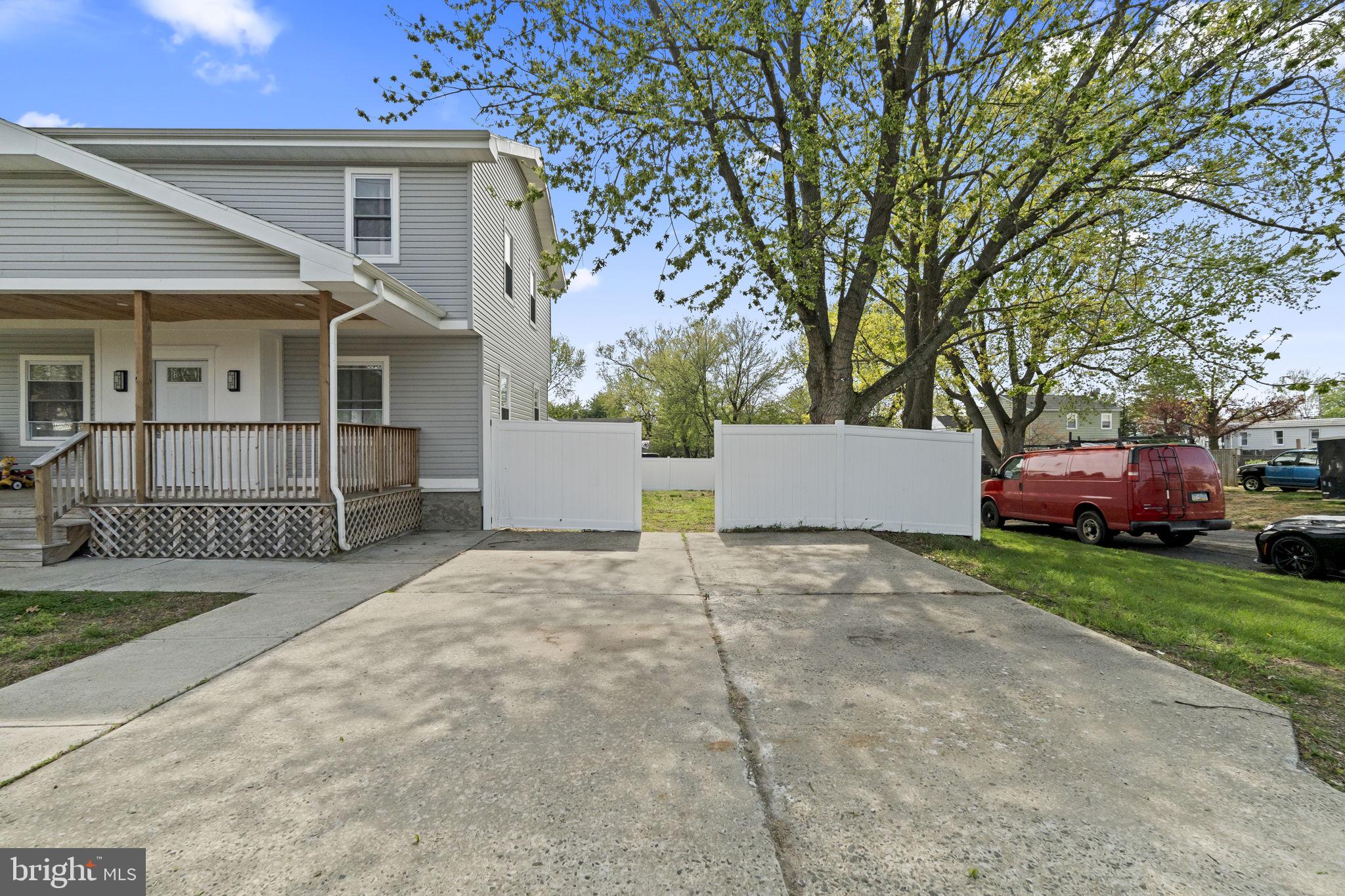 1901 Jackson Street Cinnaminson, NJ 08077 - Photo 40 of 40 front view of a house with a yard and an trees