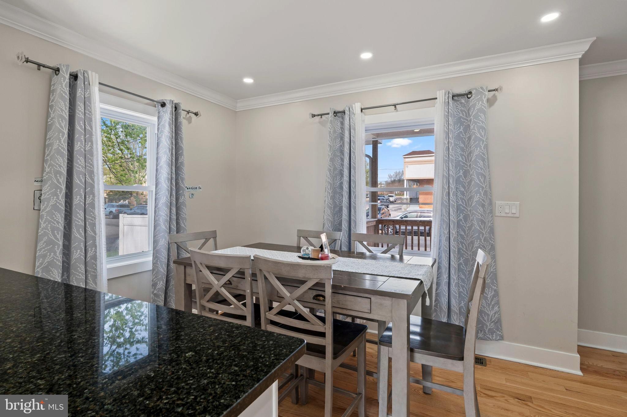 1901 Jackson Street Cinnaminson, NJ 08077 - Photo 8 of 40 a view of a dining room with furniture and wooden floor