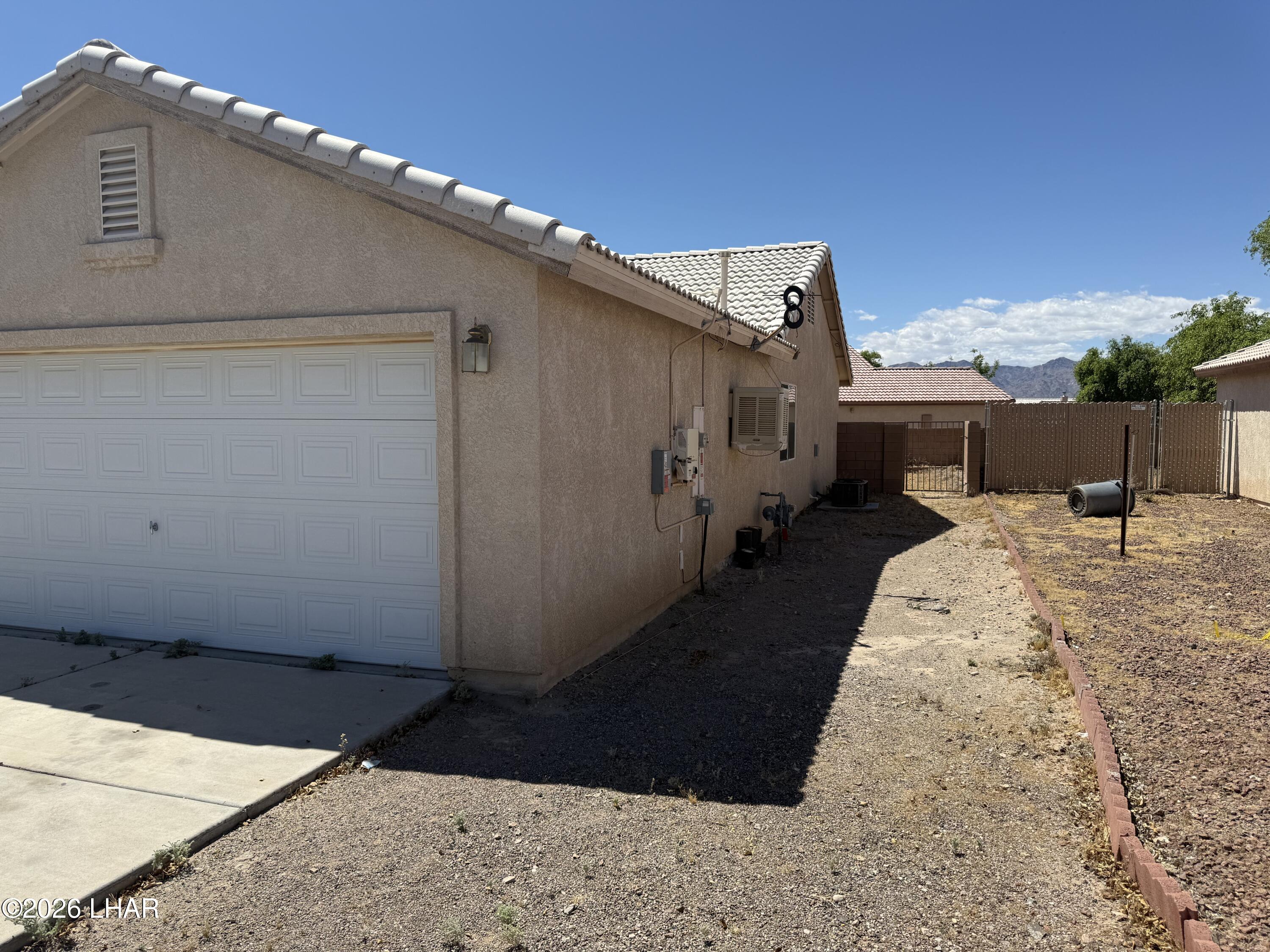 4897 South Rinaldi Drive Fort Mohave, AZ 86426 - Photo 21 of 22 a backyard of a house