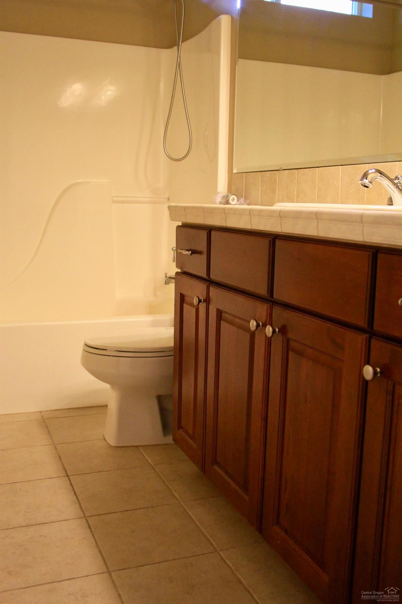 19459 Blue Lake Loop Bend, OR 97702 - Photo 17 of 19 a bathroom with a sink a toilet and shower