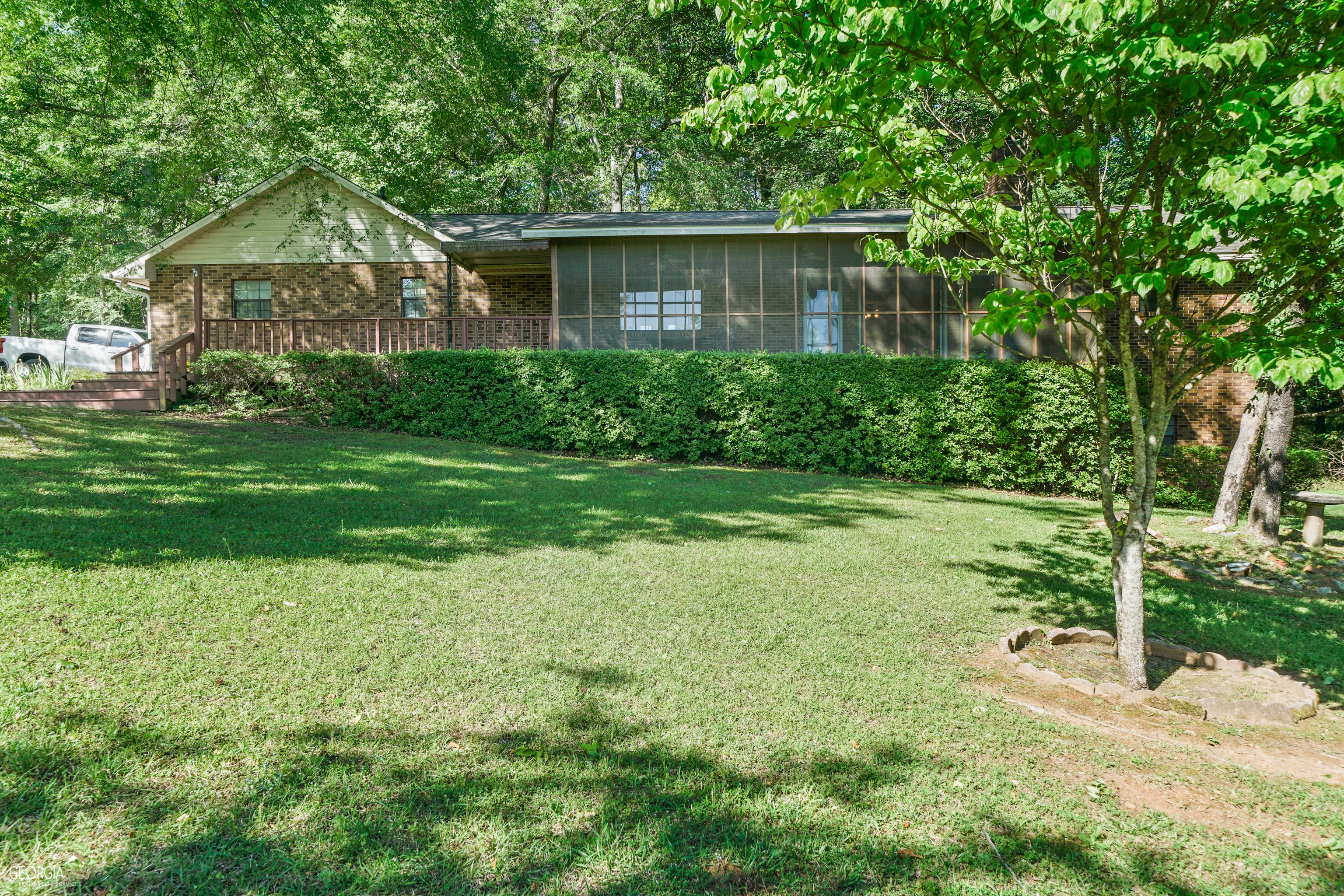 163 A Pennington Road Northwest Milledgeville, GA 31061 - Photo 1 of 1 a front view of a house with a yard