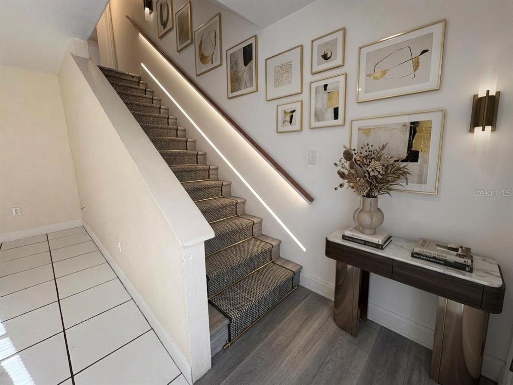 4033 Henley Road, Unit 1707 Orlando, FL 32839 - Photo 9 of 66 a view of entryway and hall with wooden floor