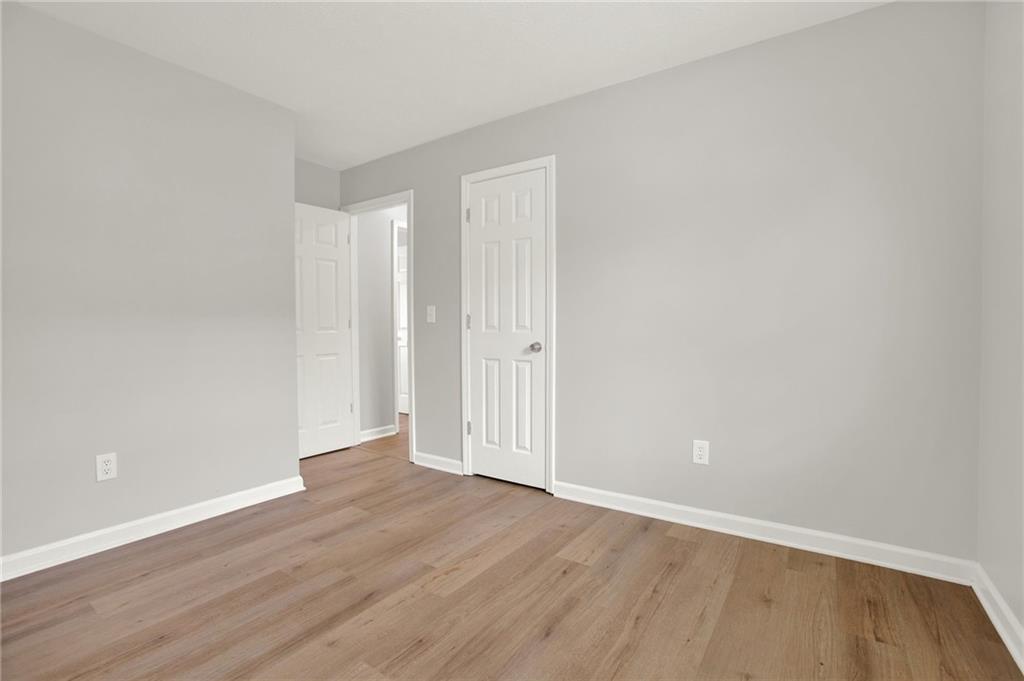 76 Picklesimer Road Southwest Cartersville, GA 30120 - Photo 25 of 43 a view of an empty room with wooden floor
