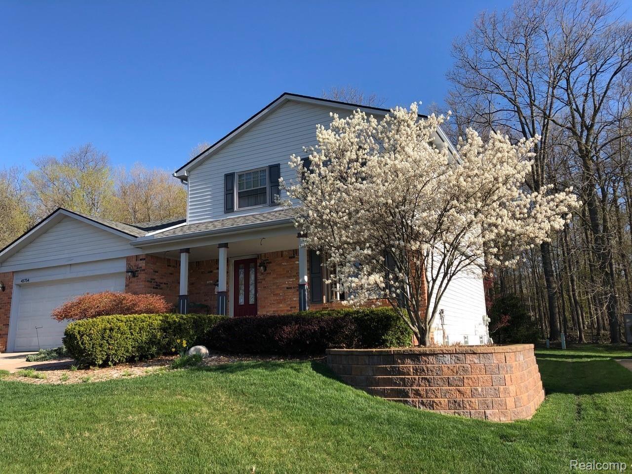 45754 Cider Mill Road Novi, MI 48374 - Photo 2 of 47 Springtime Bloom on east side of home