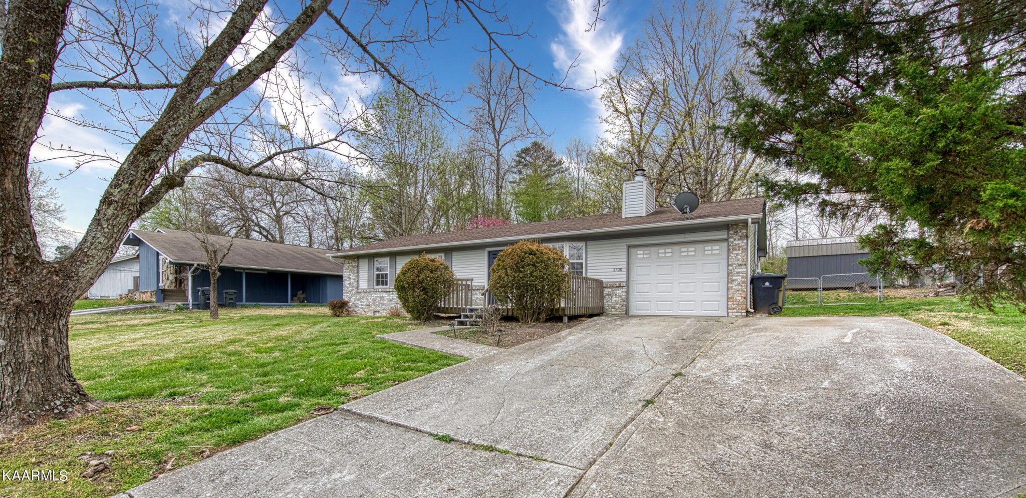 5708 Outer Drive Knoxville, TN 37921 - Photo 3 of 23 a view of a house with a yard and garage