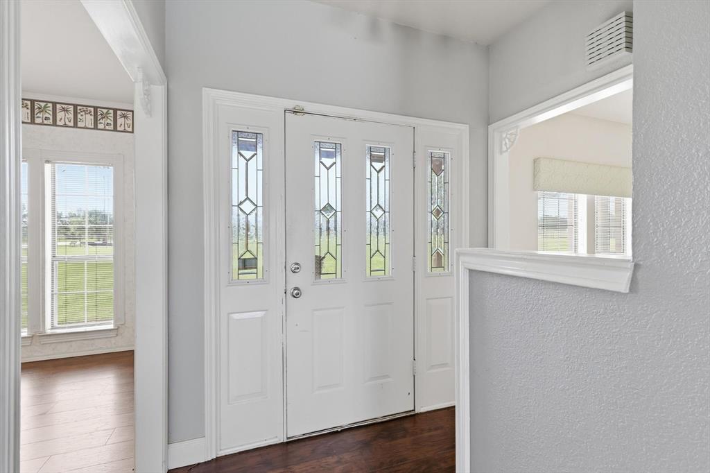 211 Bayne Road Haslet, TX 76052 - Photo 5 of 29 a view of an entryway with wooden floor