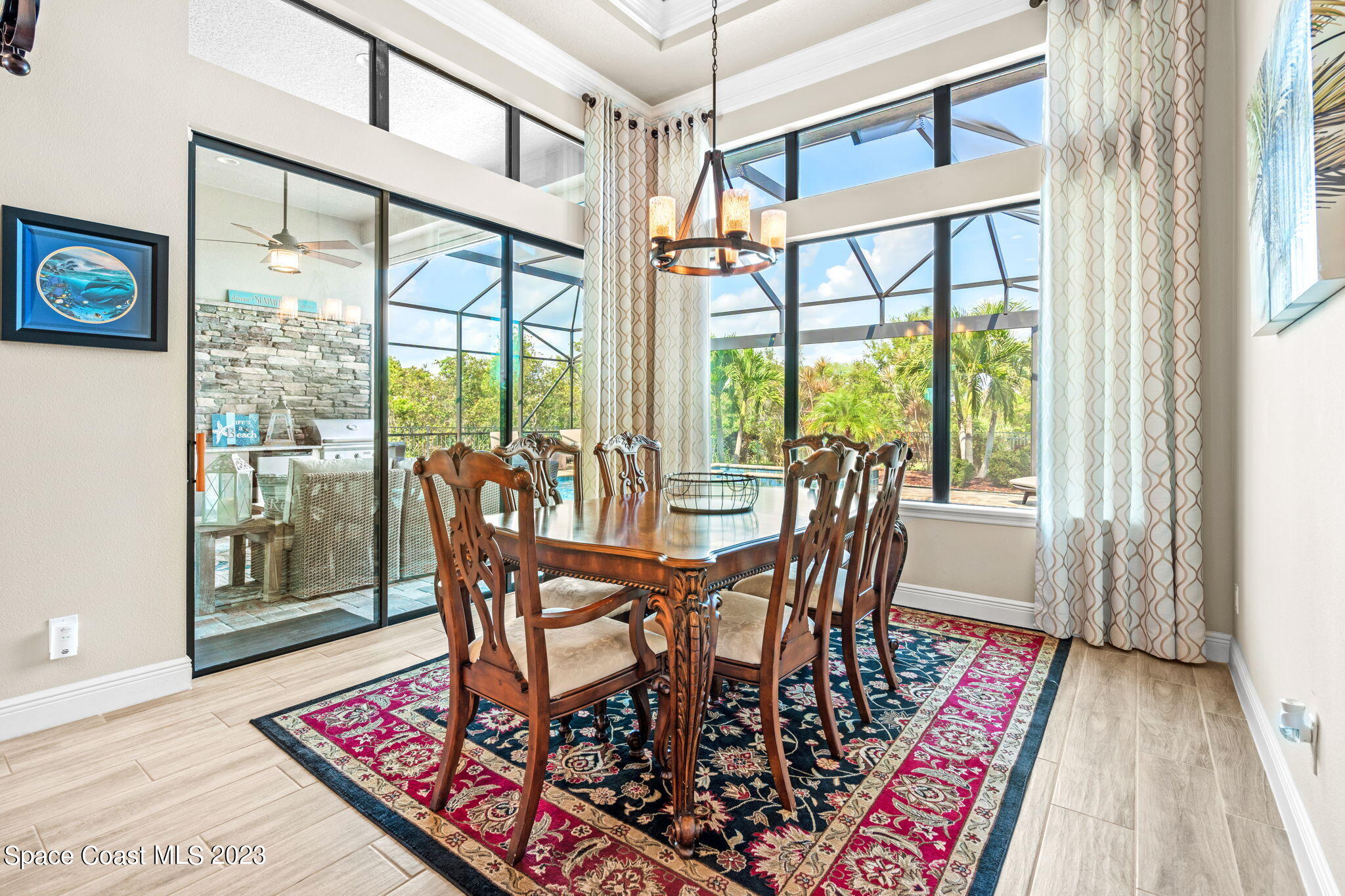 5530 Calder Drive Melbourne, FL 32940 - Photo 21 of 63 a view of a dining room with furniture wooden floor and a rug
