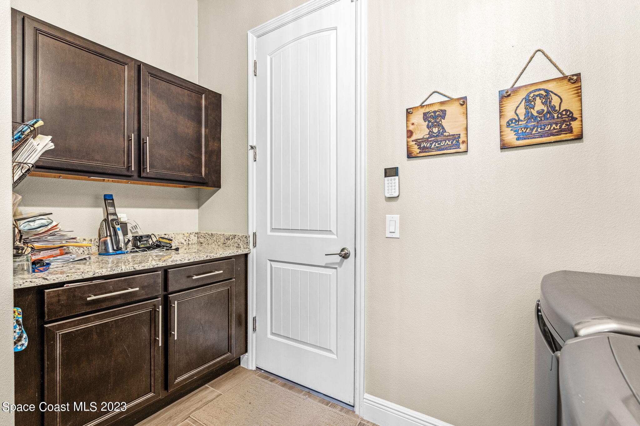 5530 Calder Drive Melbourne, FL 32940 - Photo 22 of 63 a kitchen with stainless steel appliances granite countertop a refrigerator and a sink