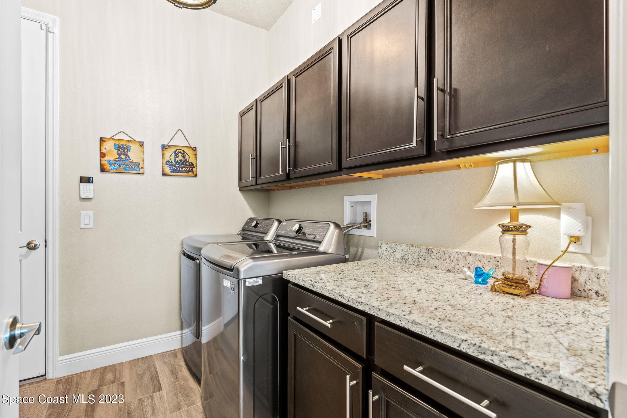 5530 Calder Drive Melbourne, FL 32940 - Photo 23 of 63 a kitchen with a sink and cabinets