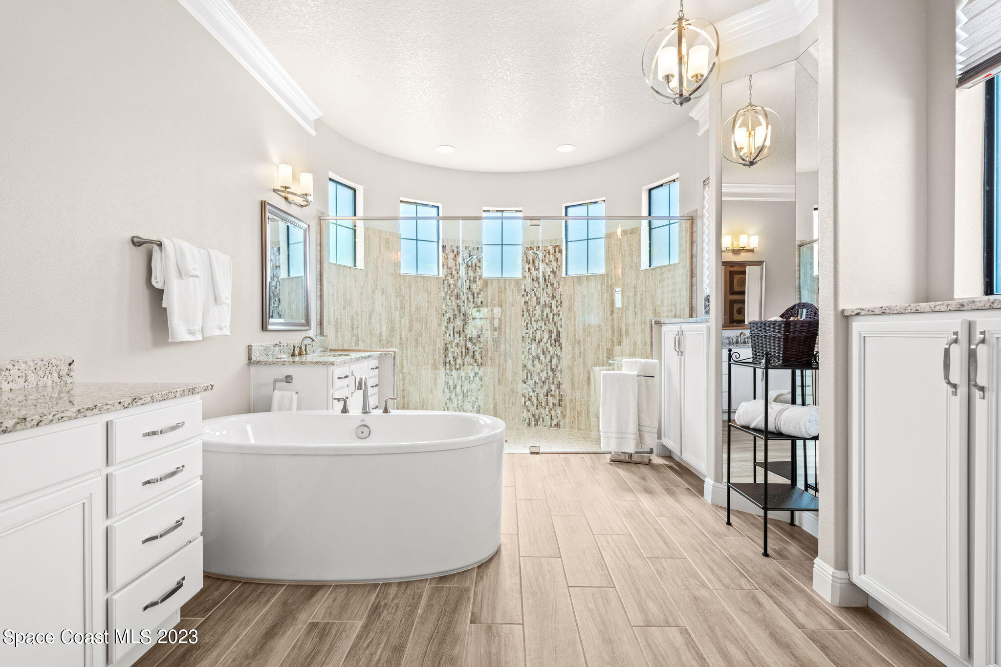 5530 Calder Drive Melbourne, FL 32940 - Photo 29 of 63 a bathroom with a double vanity sink and a mirror