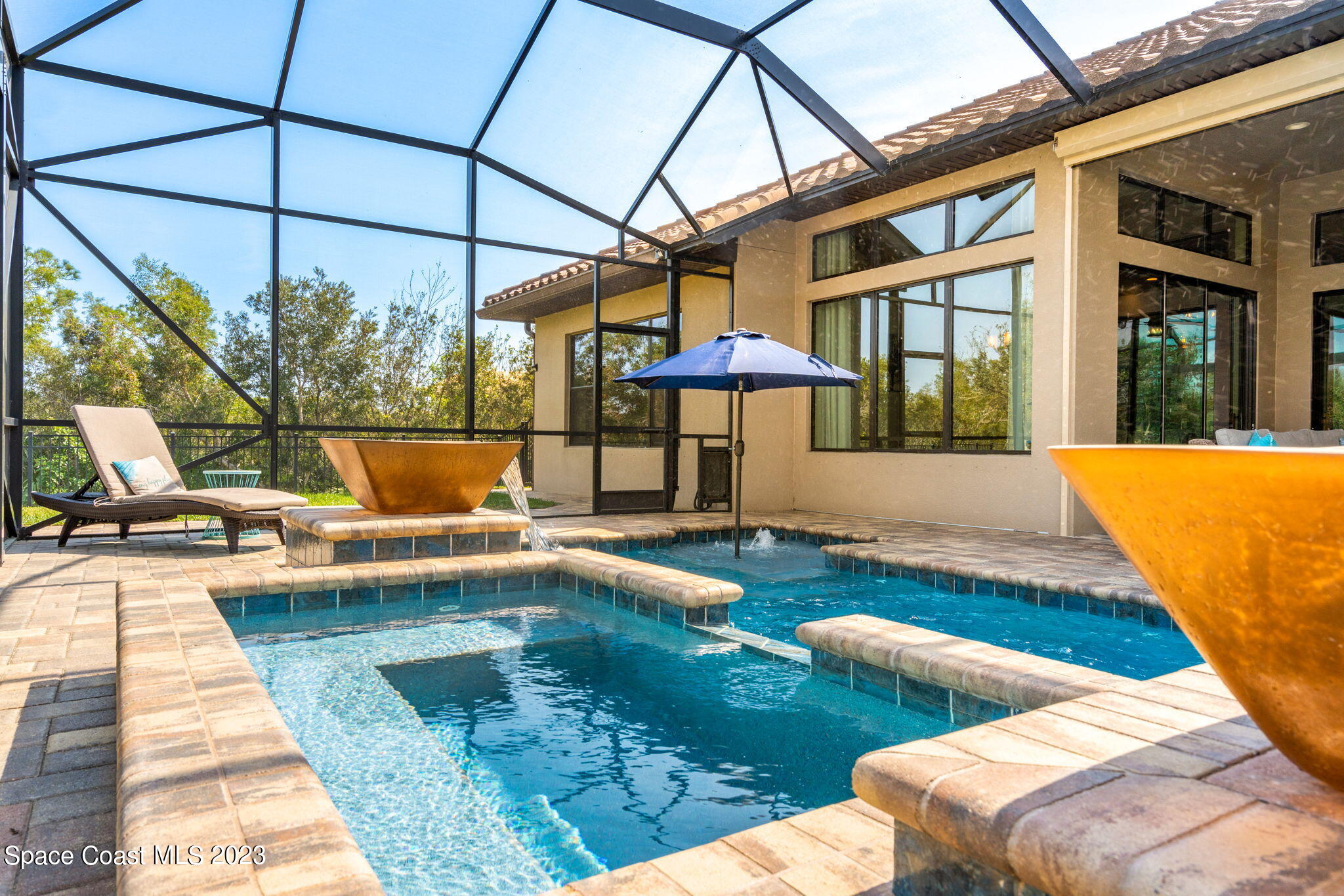 5530 Calder Drive Melbourne, FL 32940 - Photo 40 of 63 a view of a swimming pool with a patio