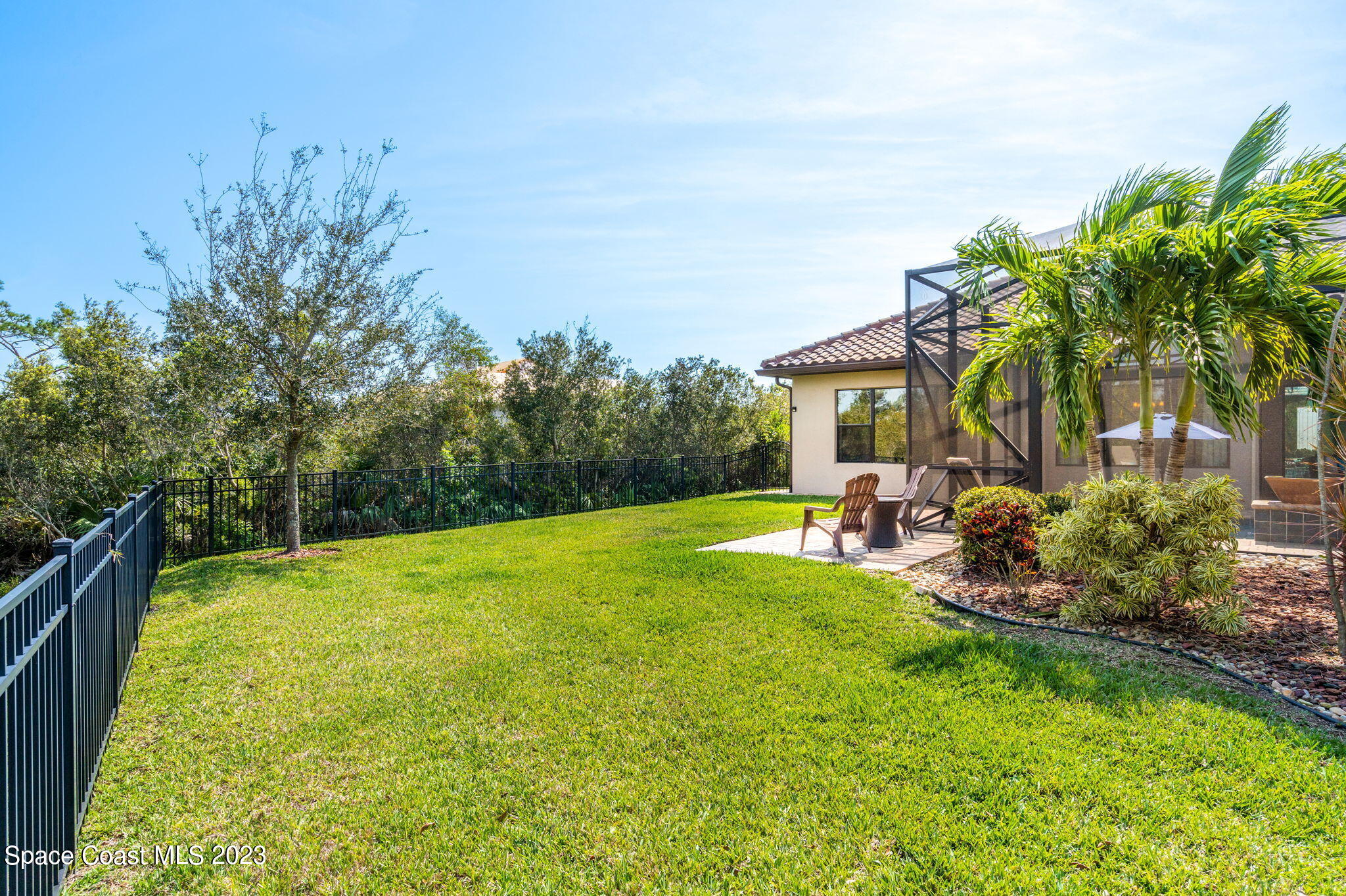 5530 Calder Drive Melbourne, FL 32940 - Photo 53 of 63 a view of a swimming pool with a garden and plants