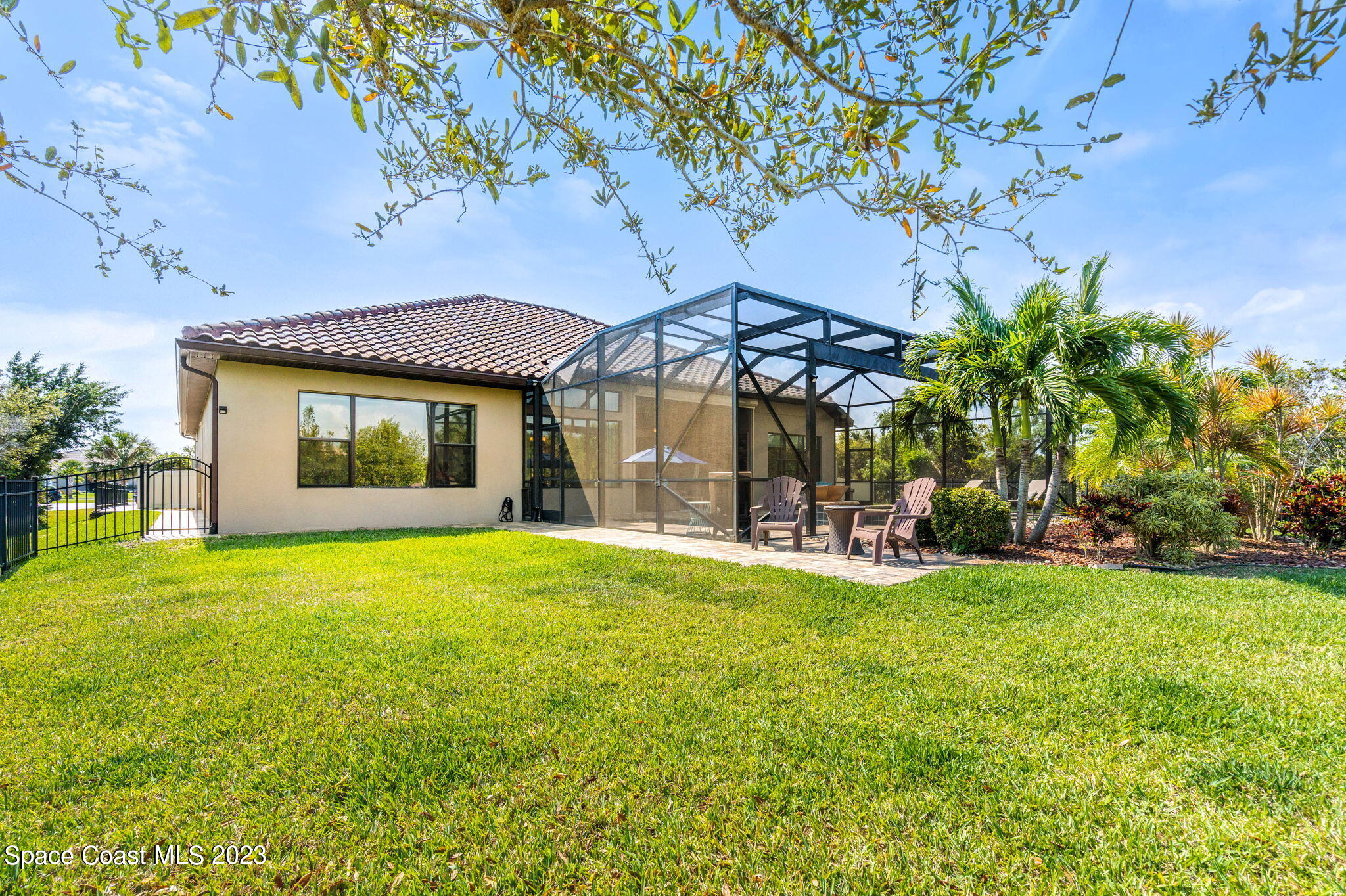 5530 Calder Drive Melbourne, FL 32940 - Photo 55 of 63 a view of a house with a yard and sitting area