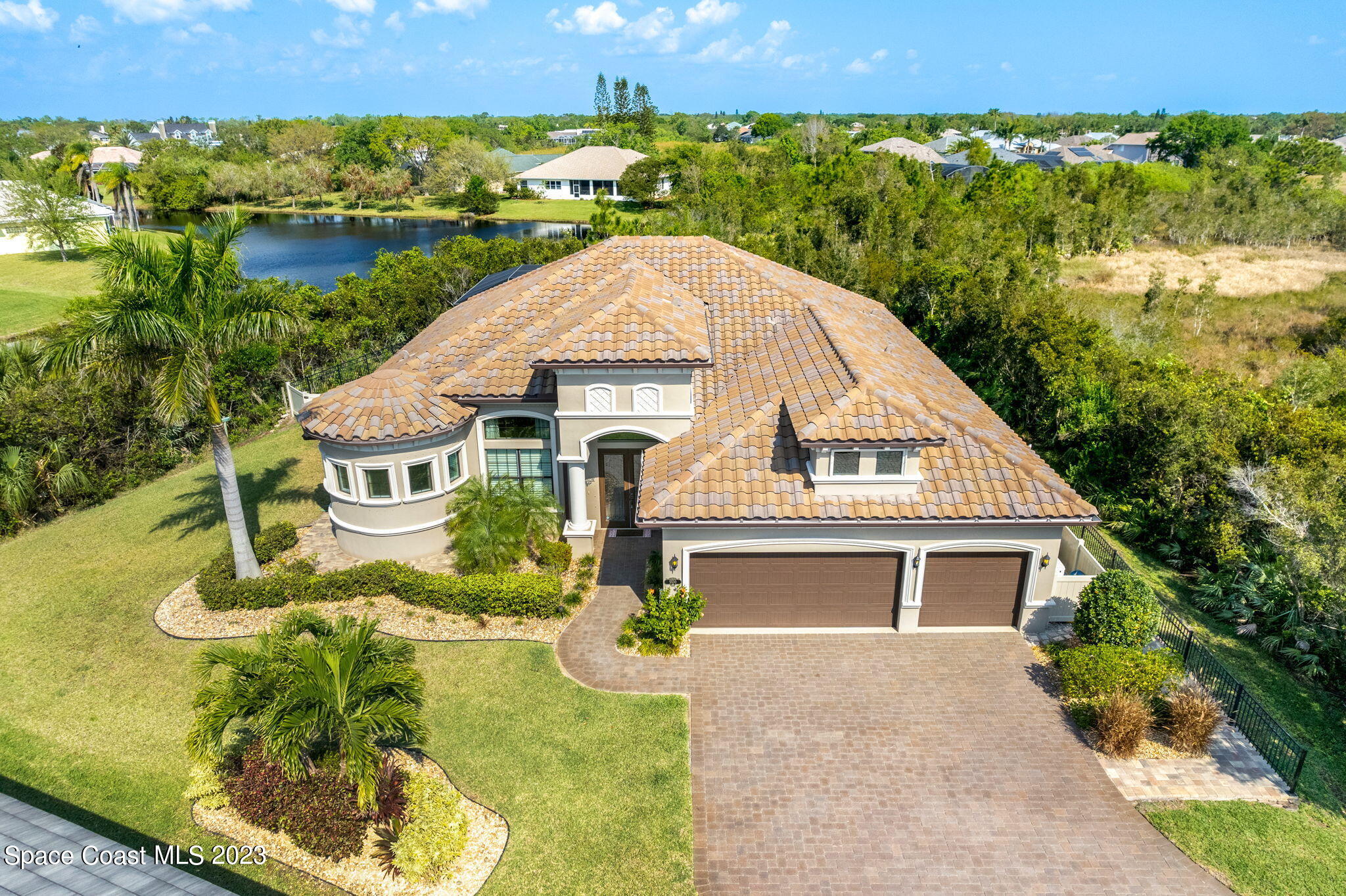5530 Calder Drive Melbourne, FL 32940 - Photo 57 of 63 an aerial view of a house with a yard