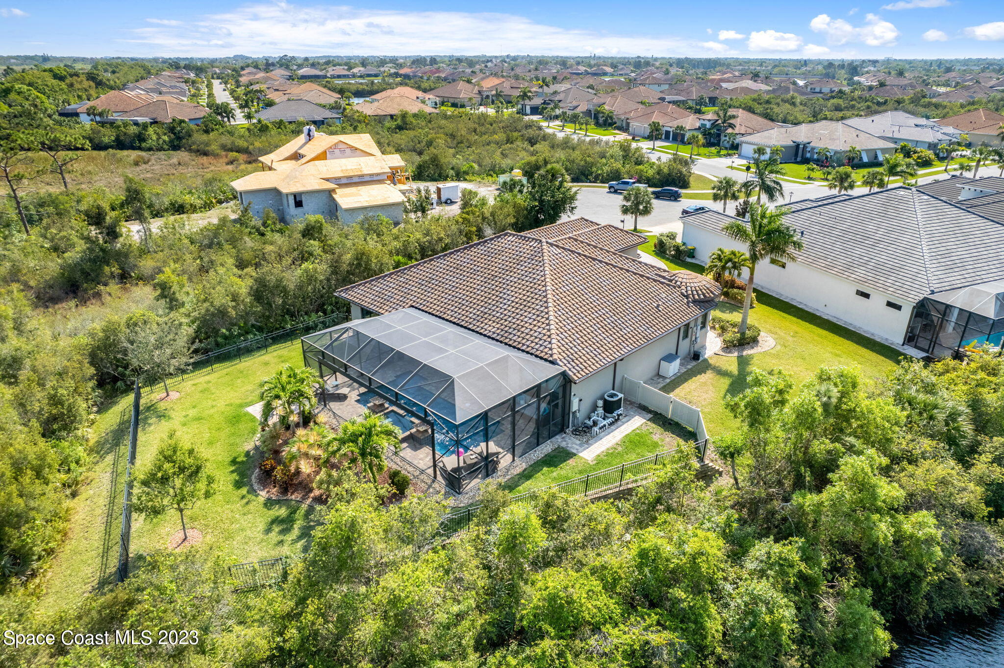 5530 Calder Drive Melbourne, FL 32940 - Photo 61 of 63 an aerial view of residential houses with outdoor space and trees
