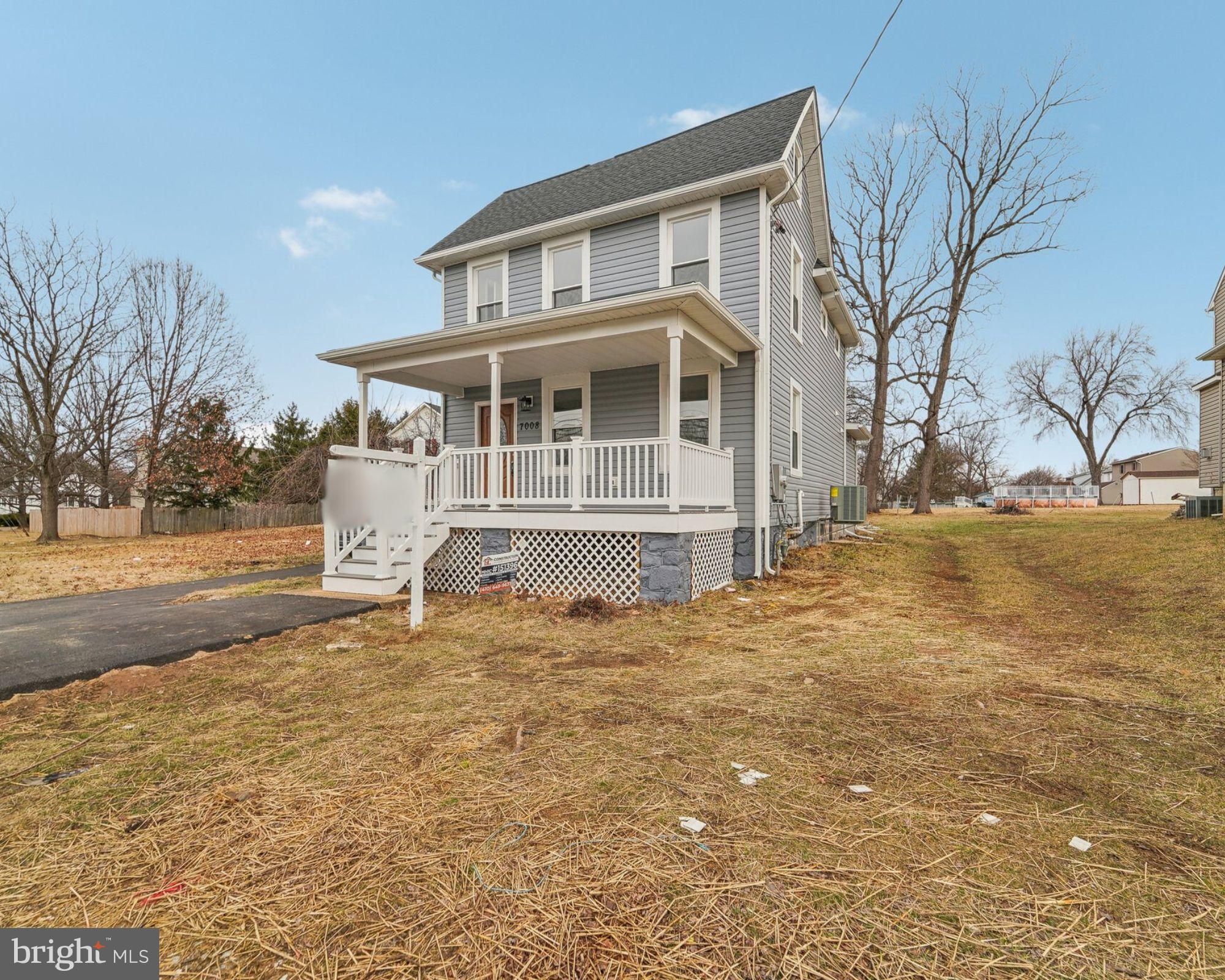 7008 Windsor Mill Road Baltimore, MD 21207 - Photo 1 of 34 a front view of a house with a yard
