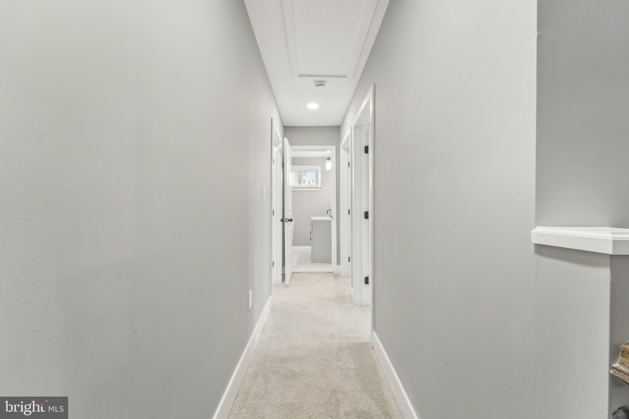 7008 Windsor Mill Road Baltimore, MD 21207 - Photo 18 of 34 a view of a hallway with wooden floor