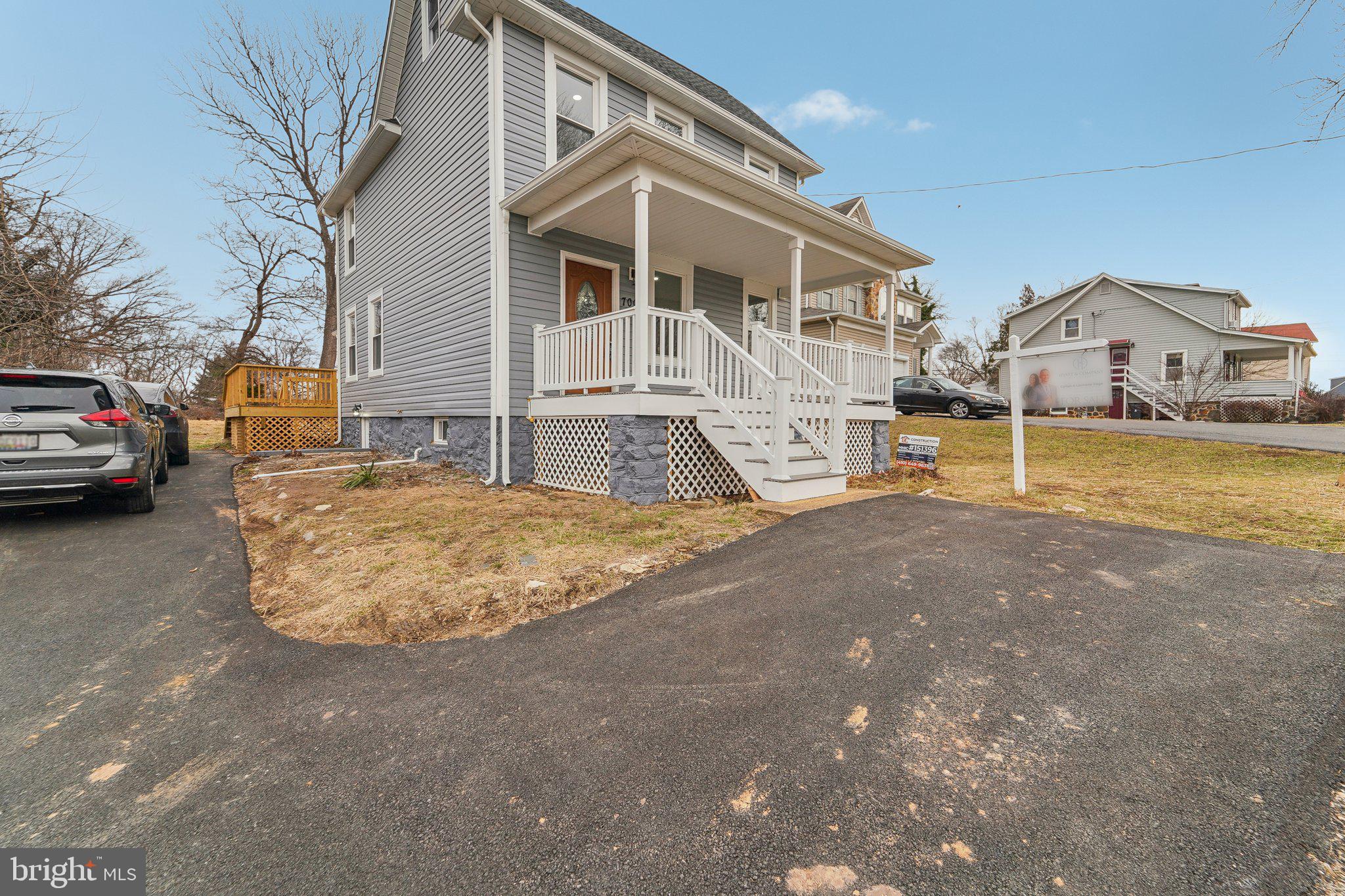 7008 Windsor Mill Road Baltimore, MD 21207 - Photo 2 of 34 a view of a house with cars parked on the road