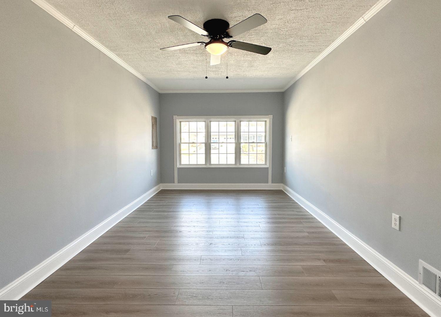 1855 Montreal Road Severn, MD 21144 - Photo 24 of 30 wooden floor in an empty room with a window