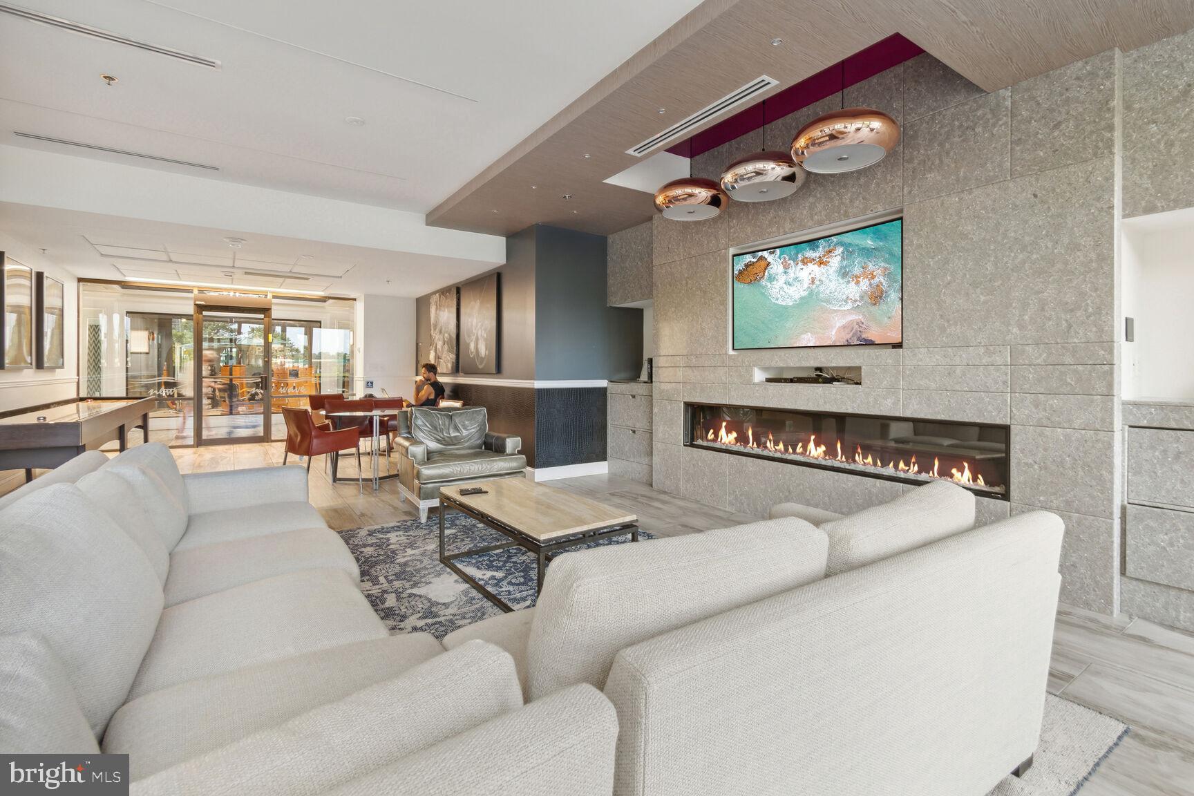 5225 Pooks Hill Road, Unit 1814N Bethesda, MD 20814 - Photo 15 of 31 a living room with furniture and a flat screen tv