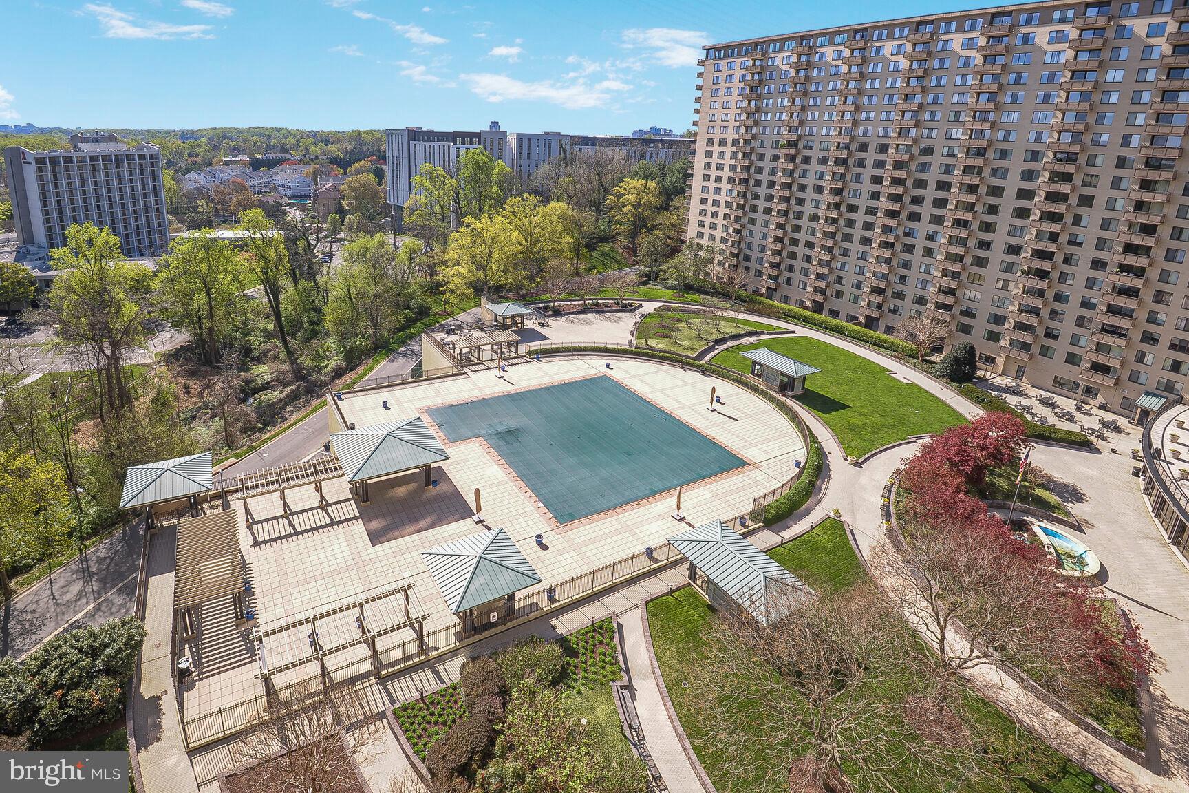 5225 Pooks Hill Road, Unit 1814N Bethesda, MD 20814 - Photo 21 of 31 a view of a balcony with a table and chairs