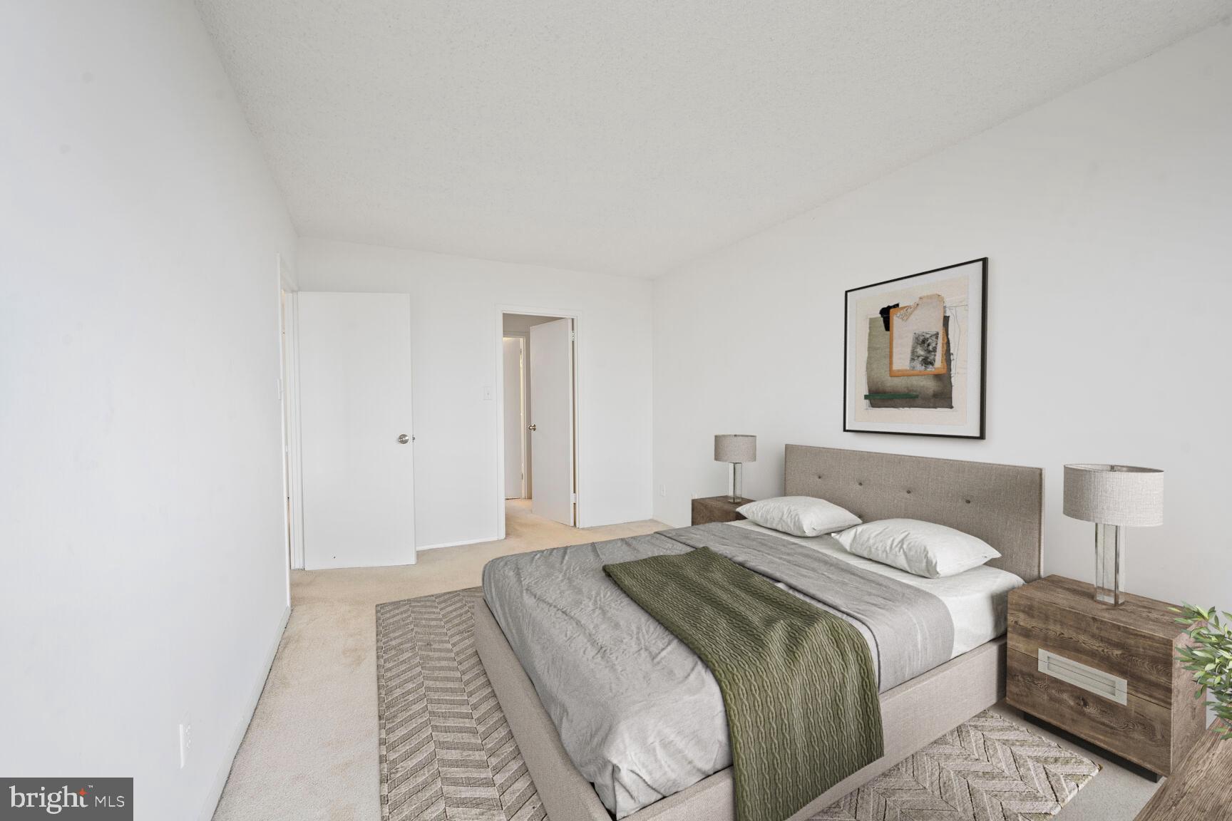 5225 Pooks Hill Road, Unit 1814N Bethesda, MD 20814 - Photo 7 of 31 a bedroom with a bed and a walk in closet