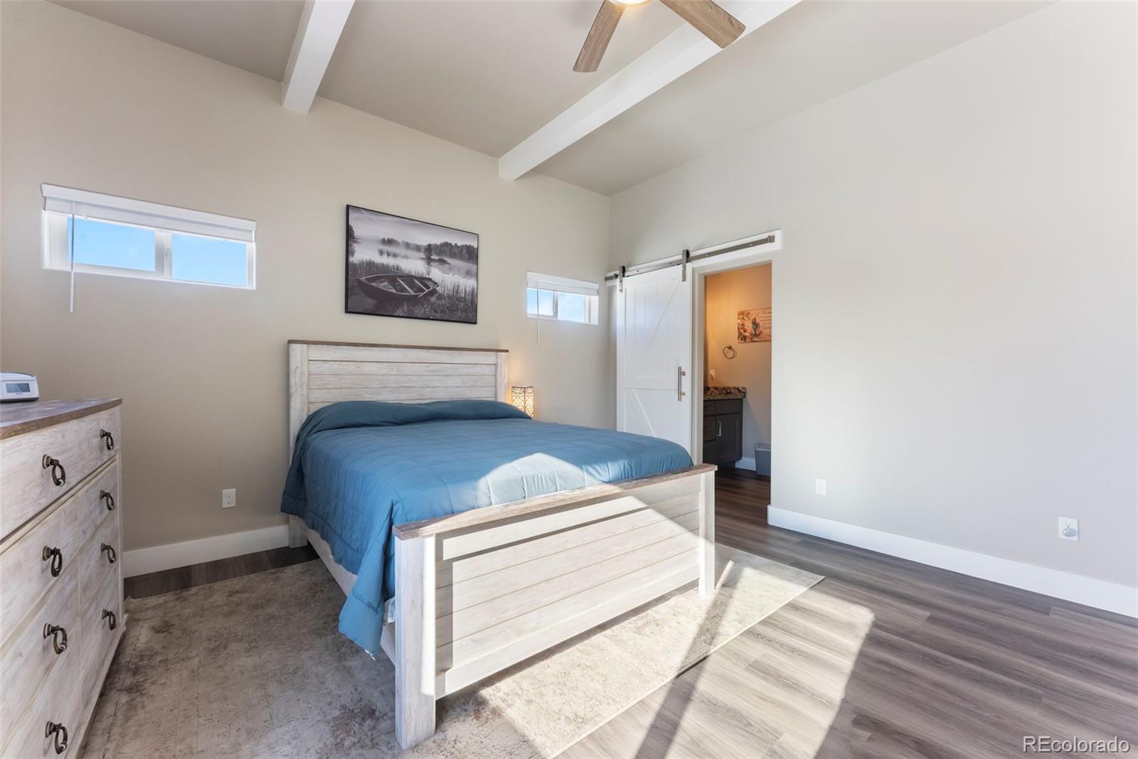 489 Duesouth Road Florissant, CO 80816 - Photo 17 of 40 a bedroom with a bed and a window