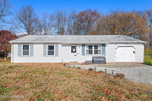 a house with trees in the background
