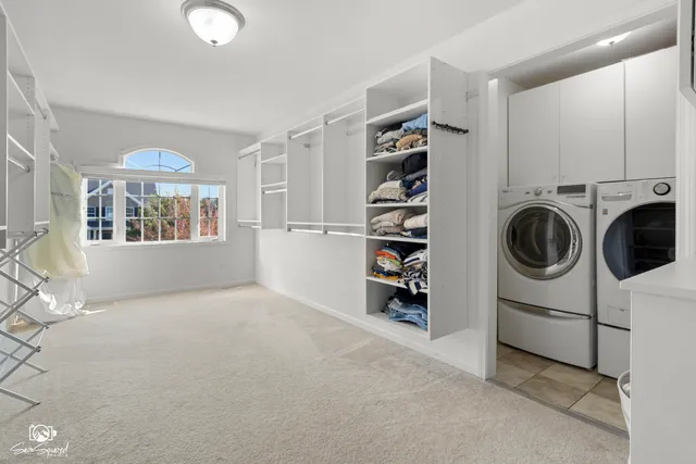 a view of a livingroom with furniture and a window