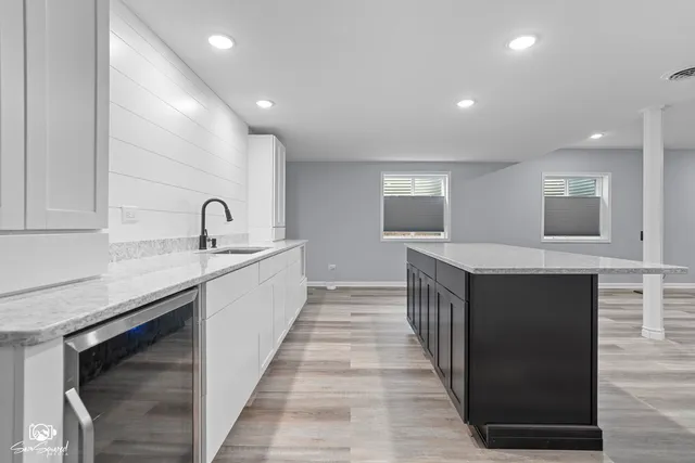 a kitchen with a sink and cabinets