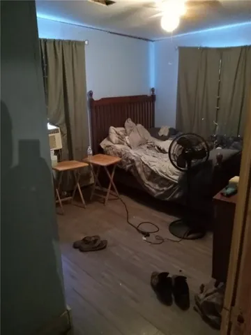 a bedroom with a bed and a bookshelf