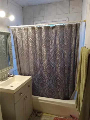 a kitchen with stainless steel appliances granite countertop a refrigerator a stove and a sink