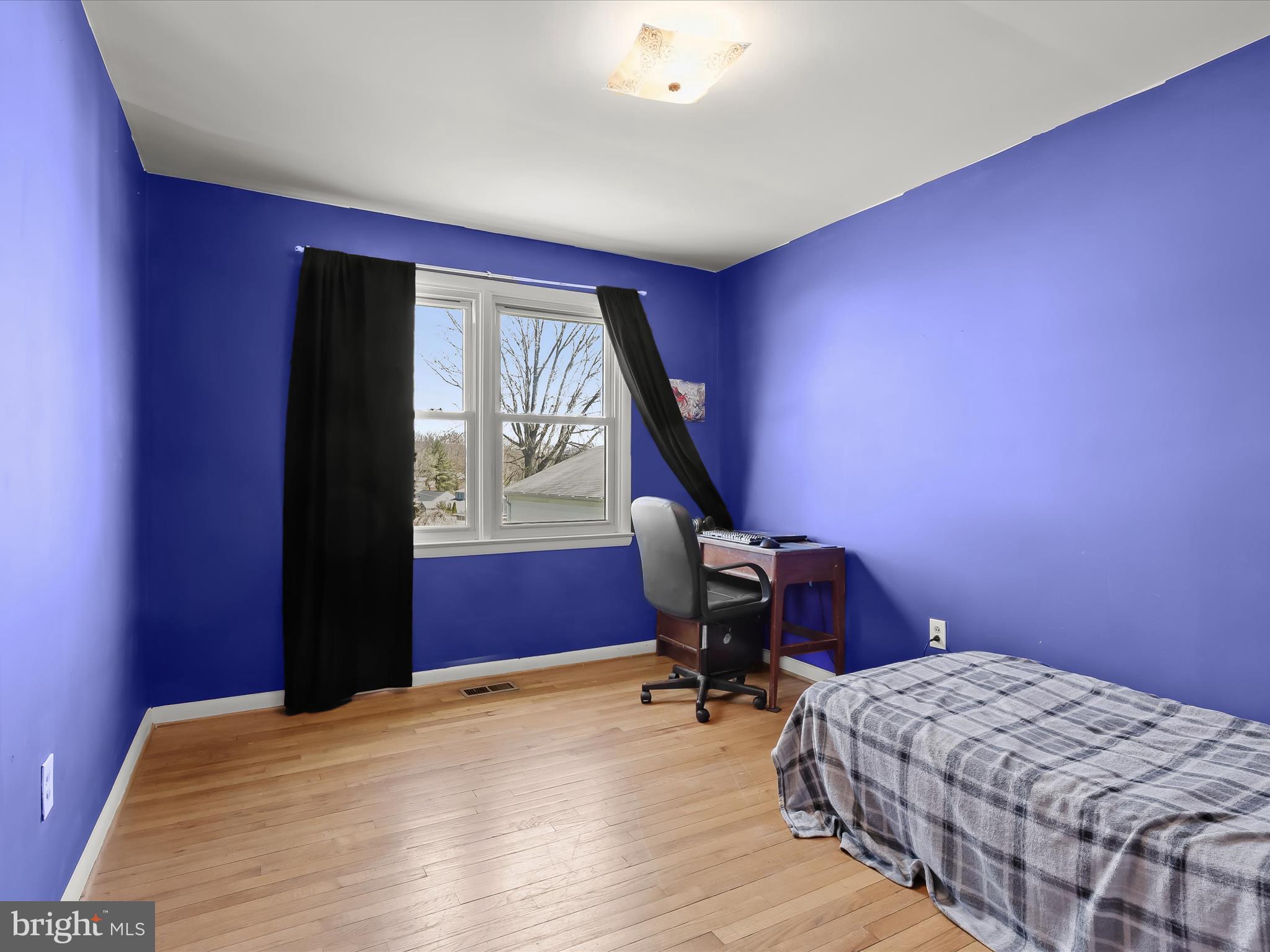 1543 South Rolling Road Halethorpe, MD 21227 - Photo 18 of 26 a bedroom with a bed and a window