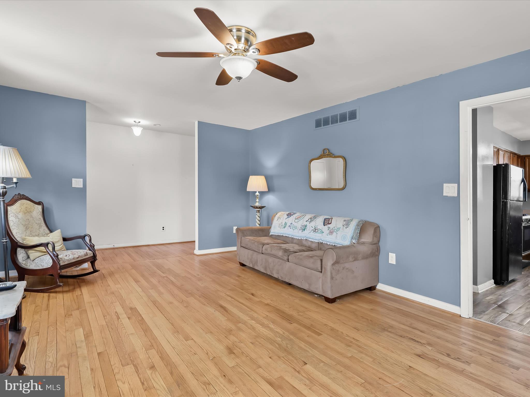 1543 South Rolling Road Halethorpe, MD 21227 - Photo 7 of 26 a living room with furniture and a wooden floor