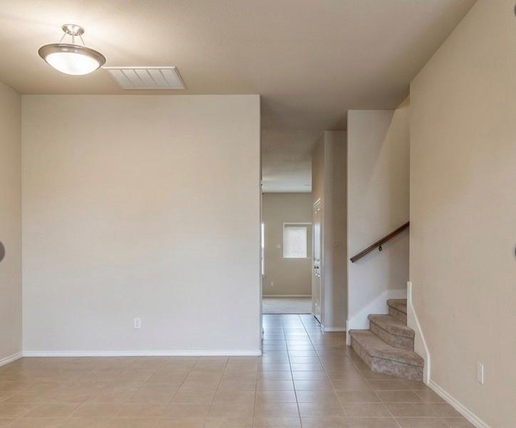415 Harding Lane Lavon, TX 75166 - Photo 2 of 13 Neutral-toned interior with tile flooring
