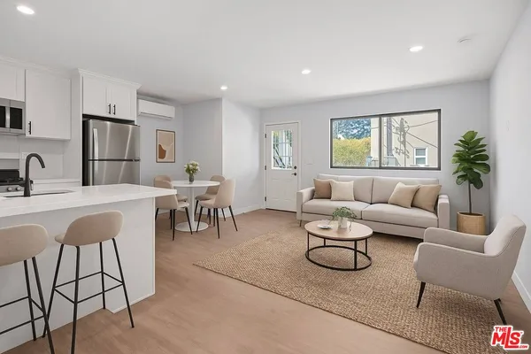 a living room with furniture and a table