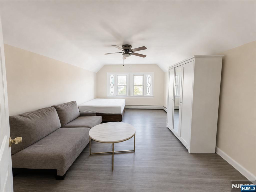 270 Pacific Street, Unit 3 Paterson, NJ 07503 - Photo 1 of 11 a living room with furniture and a large window