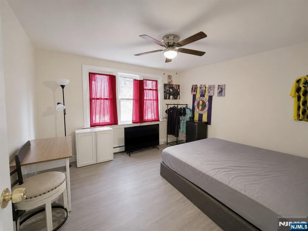 270 Pacific Street, Unit 3 Paterson, NJ 07503 - Photo 3 of 11 a living room with furniture and a window
