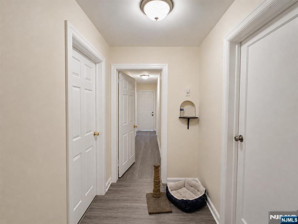 270 Pacific Street, Unit 3 Paterson, NJ 07503 - Photo 6 of 11 a bathroom with a granite countertop sink and toilet