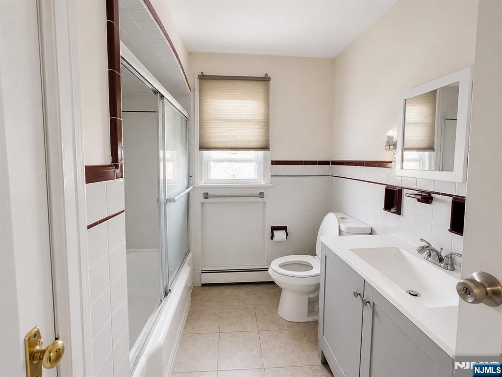 270 Pacific Street, Unit 3 Paterson, NJ 07503 - Photo 7 of 11 a bathroom with a sink toilet and shower