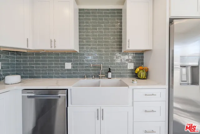 a kitchen with a sink and a cabinets