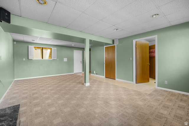 2088 Falcon Way Sandy, UT 84093 - Photo 30 of 46 Spacious room featuring patterned carpet flooring and light green walls